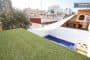 cesped-artificial-azotea-casa-con-contenedor