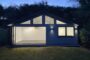 fachada nocturna Apex Optima de Garden Spaces